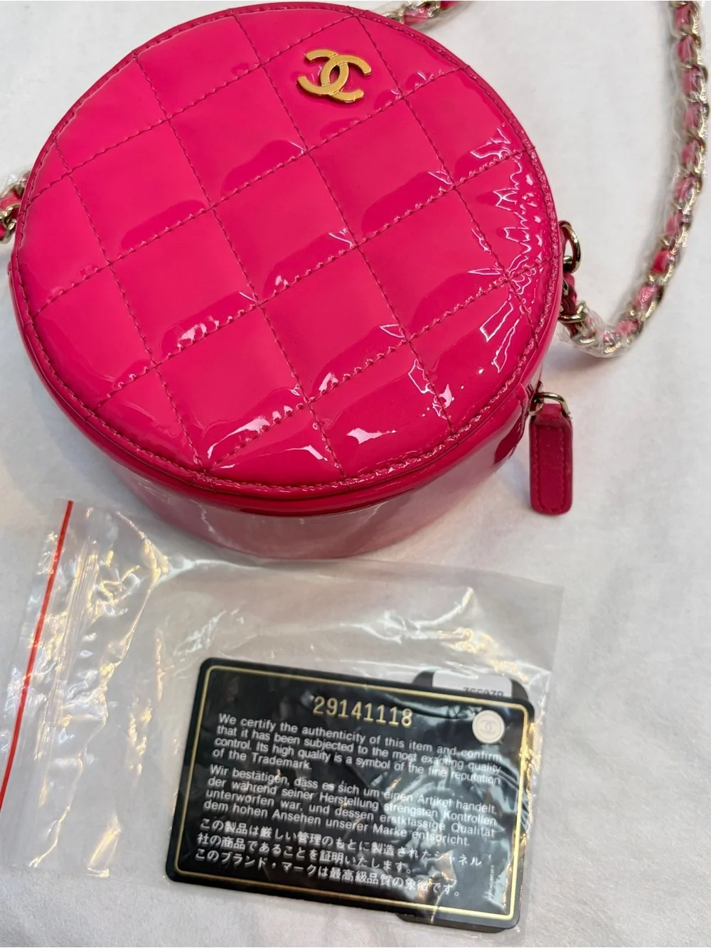 CHANEL Hot Pink Quilted Patent Leather Round Crossbody with Gold CC
